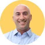 David Zerwin, Sr. Director Sales Operations at Iterable headshot on yellow background